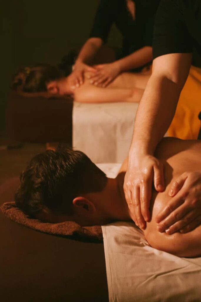 Couple receiving simultaneous back massage therapy at Holistic Luxury Spa & Salon, Bhopal